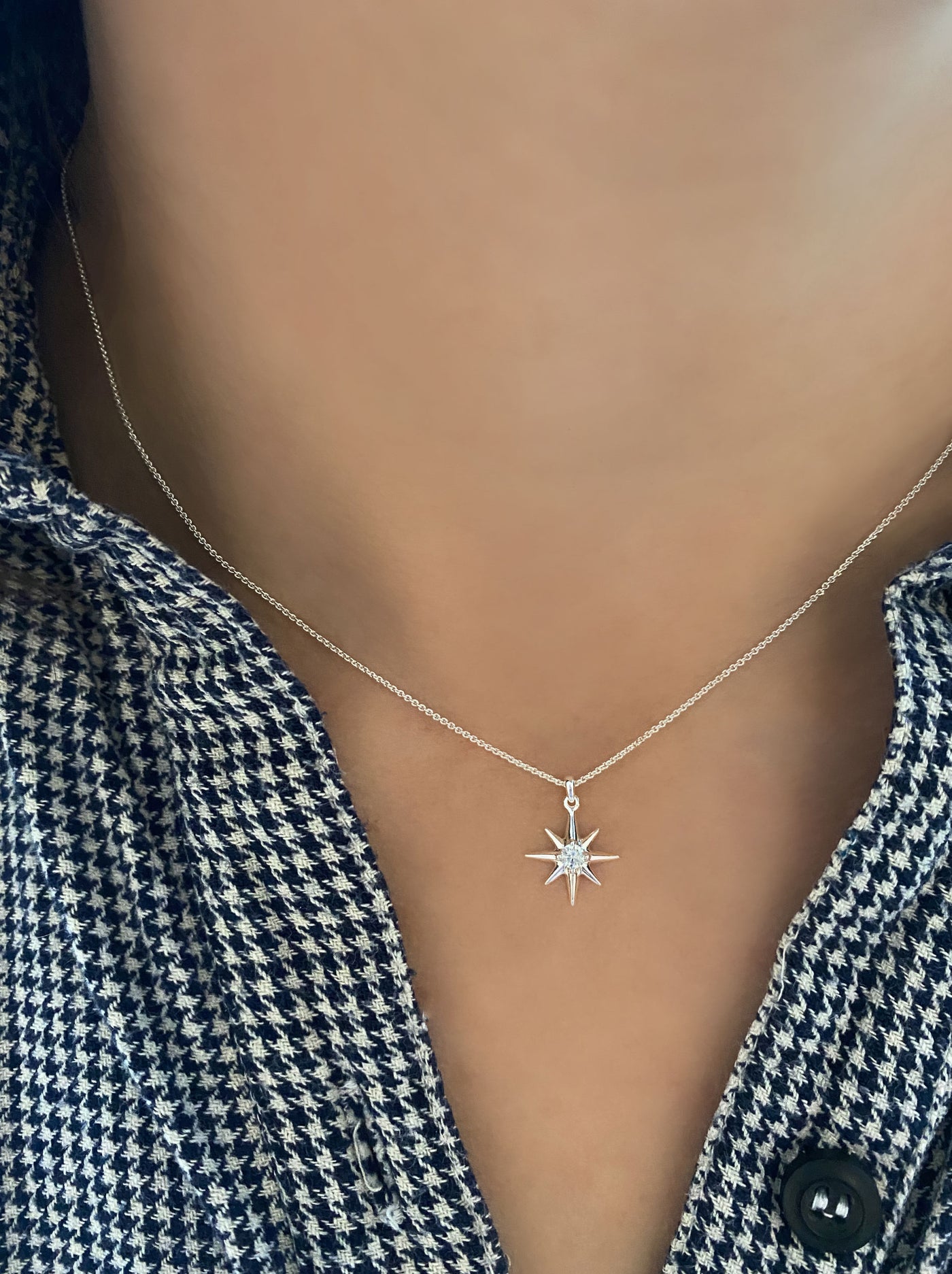 Model wearing silver dainty star necklace with CZ crystal 