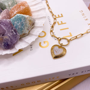 Flatlay of Gold plated sterling silver agate heart pendant necklace on chunky chain